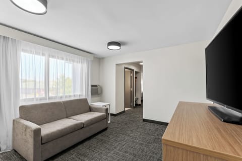 Suite, 1 Bedroom | Living area | 55-inch Smart TV with digital channels