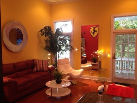 LIVING ROOM, SLEEPER SOFA,SITTING CHAIR, CEILING FAN, 75" SMART TV, HIGH CEILING