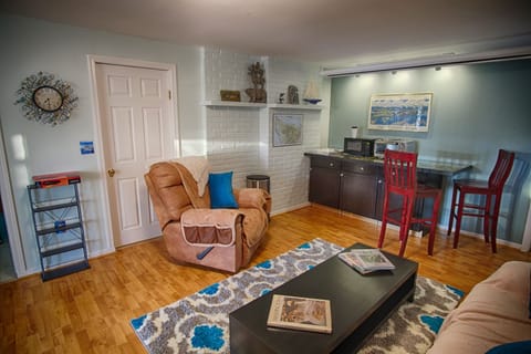 Living room w/ fridge, coffee pot (coffee provided), microwave and toaster oven