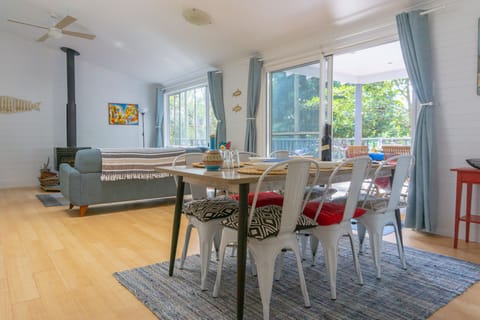 Spacious living and dining open out to tree top deck