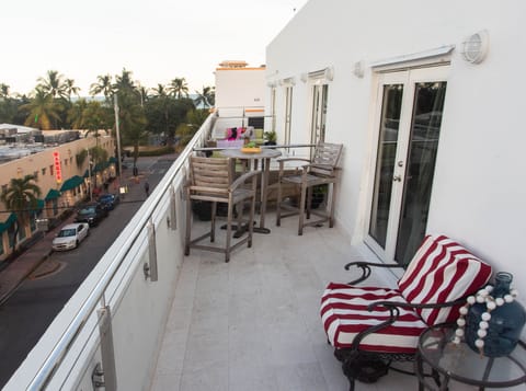 Enjoy the evening on the ocean view balcony and watch the fun on Ocean Drive.