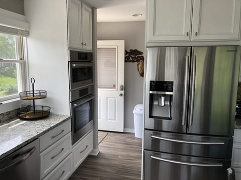 Large capacity fridge plus 2nd small one in garage.