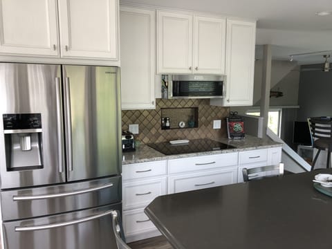 5 burner stove plus micro hood.