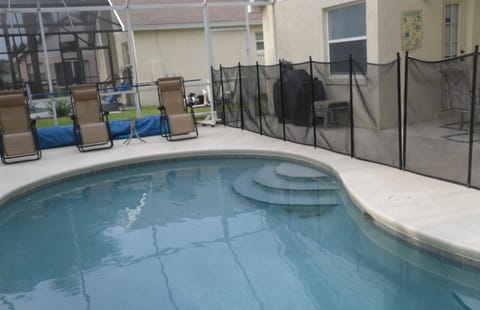 pool with Safety Face and sun lounges