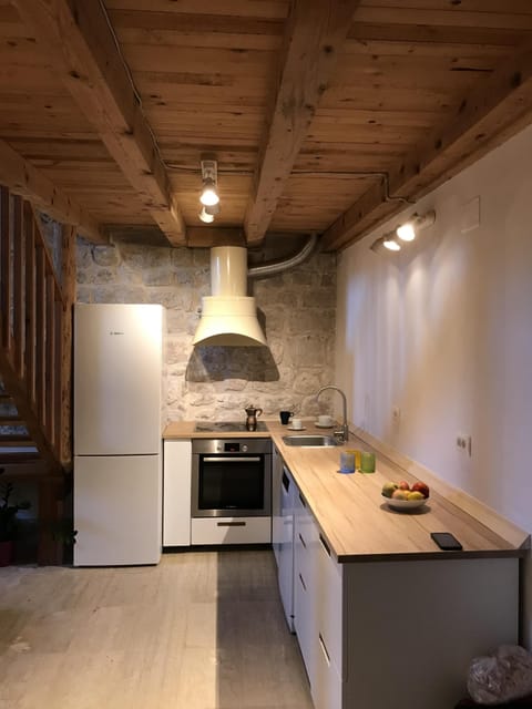 Kitchen with full size refrigerator, stove, oven, sink & dishwasher