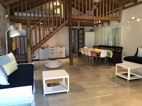 Living Area in Foreground with Kitchen/Dining Area Behind