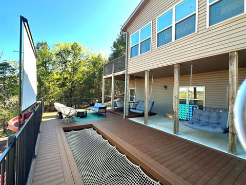 Sit outside and watch a movie from the back deck! New outdoor theatre screen and hammock!