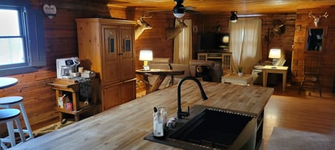 Open floor plan kitchen, living room, & dining room with Keurig/coffee pot 