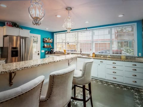 Large kitchen with professional painted floor, granite tops stainless steel apps