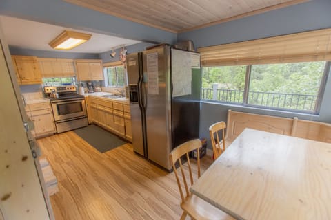 Modern kitchen is well-stocked with dishes, appliances and basic spices