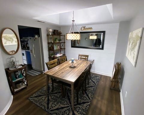 Dining area with bar cart and a book nook for those who love to read.