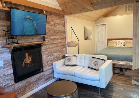 Relax in front of the cozy fireplace, open concept living space