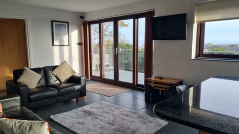 Open plan lounge with sea views