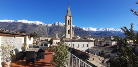 Table for six on the terrace as well as seating area and two sun beds.