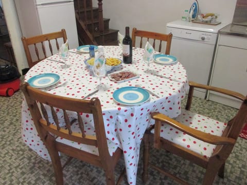 Dining table seats 5 people and is extendable for extra guests.