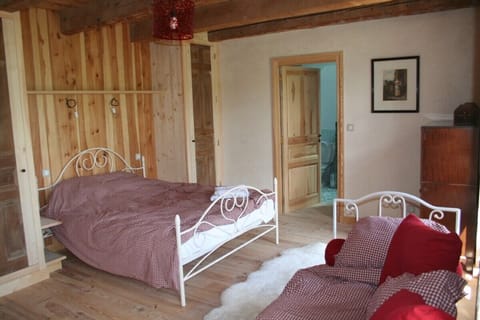 Bedroom 1 with double and single beds and en suite