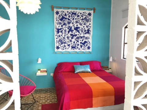 Front room with queen size bed with firm pillow top mattress.