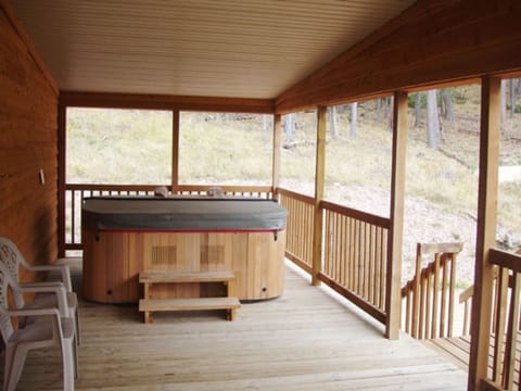 Both cabins have a deck with a hot tub.
