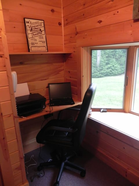 Office nook in downstairs bedroom in front of second bay window with water view