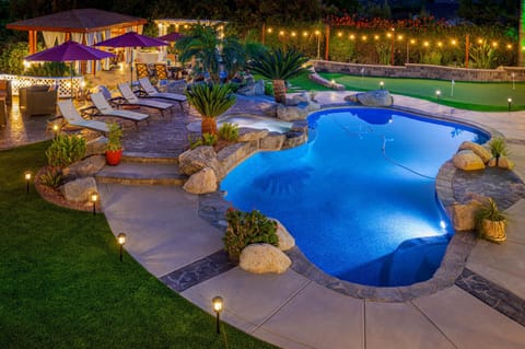 PDN's pleasing pebble-tech Pool, Jacuzzi and Deck, Gazebo, and Putting Green.