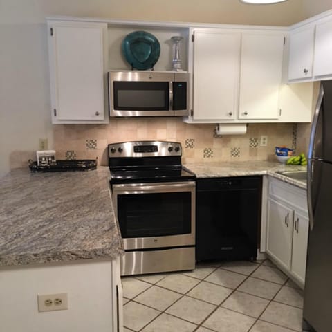Kitchen with new counter tops and back splash