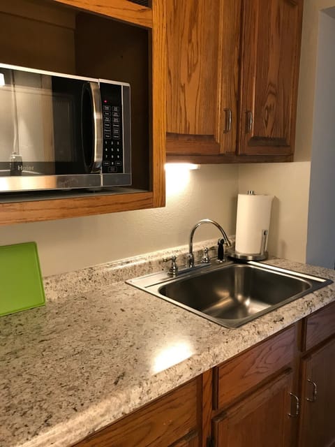 Downstairs is a Kitchenette with sink and microwave.