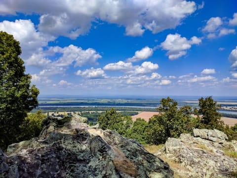 View over the boulders to river with awesome color in the sky.