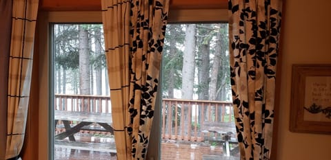 Dining room looks over large deck