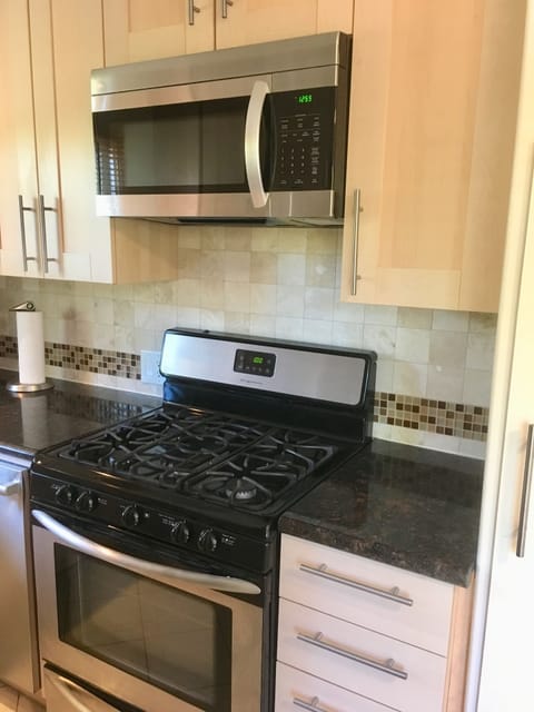 Gas range and large microwave