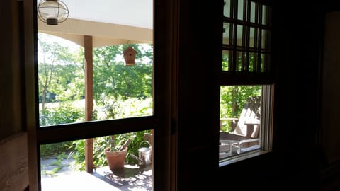 Sunny front porch is just off dining room. Lovely for morning coffee or tea.