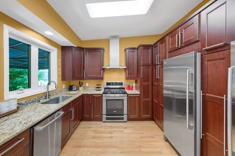 Kitchen with full sized refrigerator and freezer