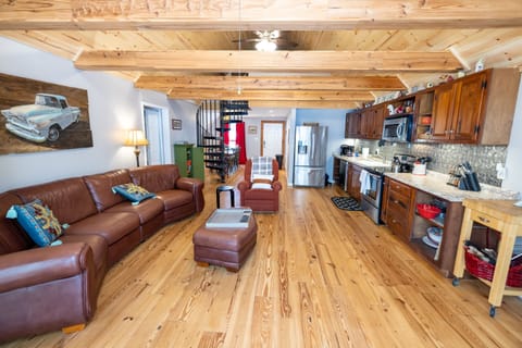 Main Aframe of the house has living room, kitchen, and dining