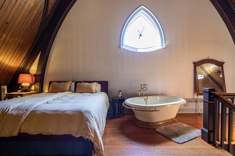 Sleep in a choir loft with the sunshine greeting you each morning