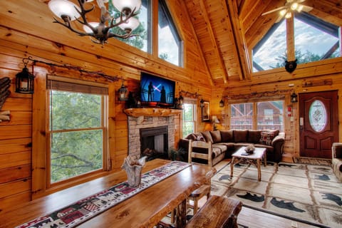 Bright vaulted ceiling Living Room with Stone Fireplace, queen sleeper sofa