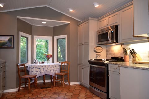 Updated kitchen with a breakfast nook overlooking river