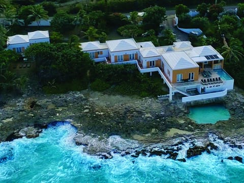 Aerial view of the main villa and cottage located on1.3 acres.