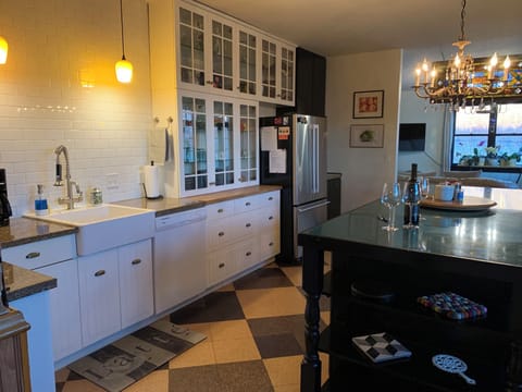 Large fully stocked kitchen, connects to first living room