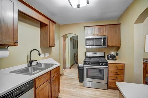 Kitchen with Gas Stove, Microwave, and Toaster