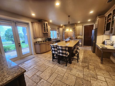 Gourmet custom kitchen with 6 burner stove.