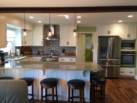 Granite peninsula with bar stools for dining 