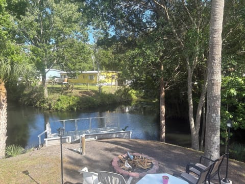 Corner dock with water on both sides.  Fire pit with outdoor seating area.