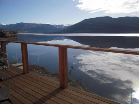 Looking north from top deck at the mountains reflected in the lake.