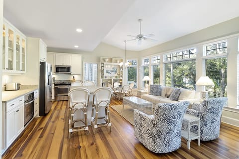 Kitchen with seating area and TV.