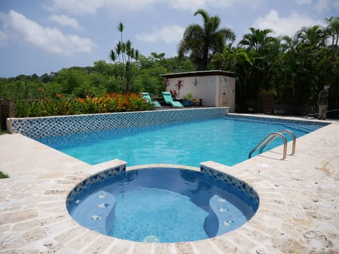 Pool and spa, with sun deck and coastal mountains in view