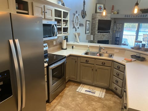 Fully stocked kitchen with new stainless appliances. 