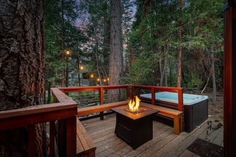 The Brookside Chalet offers a quaint fireside gathering area overlooking a creek
