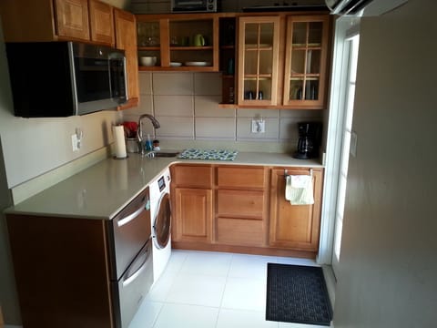 Fridge, freezer, washer, dryer and multi-purpose GE oven.