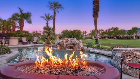 Enjoy your favorite beverage next to the custom firepit with golf course views!