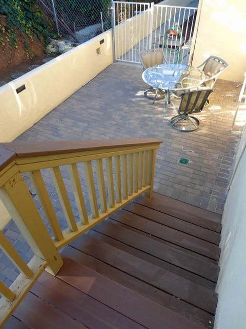Stairs Leading From 2nd Level to Private Patio (Pavers) with Table and 4 Chairs