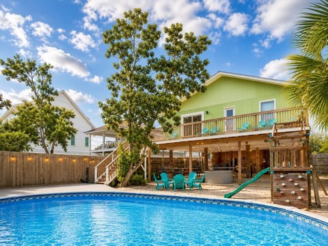 Welcome to Zula Beach Destin - 4 bedrooms, sleep 16, large 30' by 15' heated pool and hot tub, private fenced backyard and covered area. 93 Cobia St, Destin FL